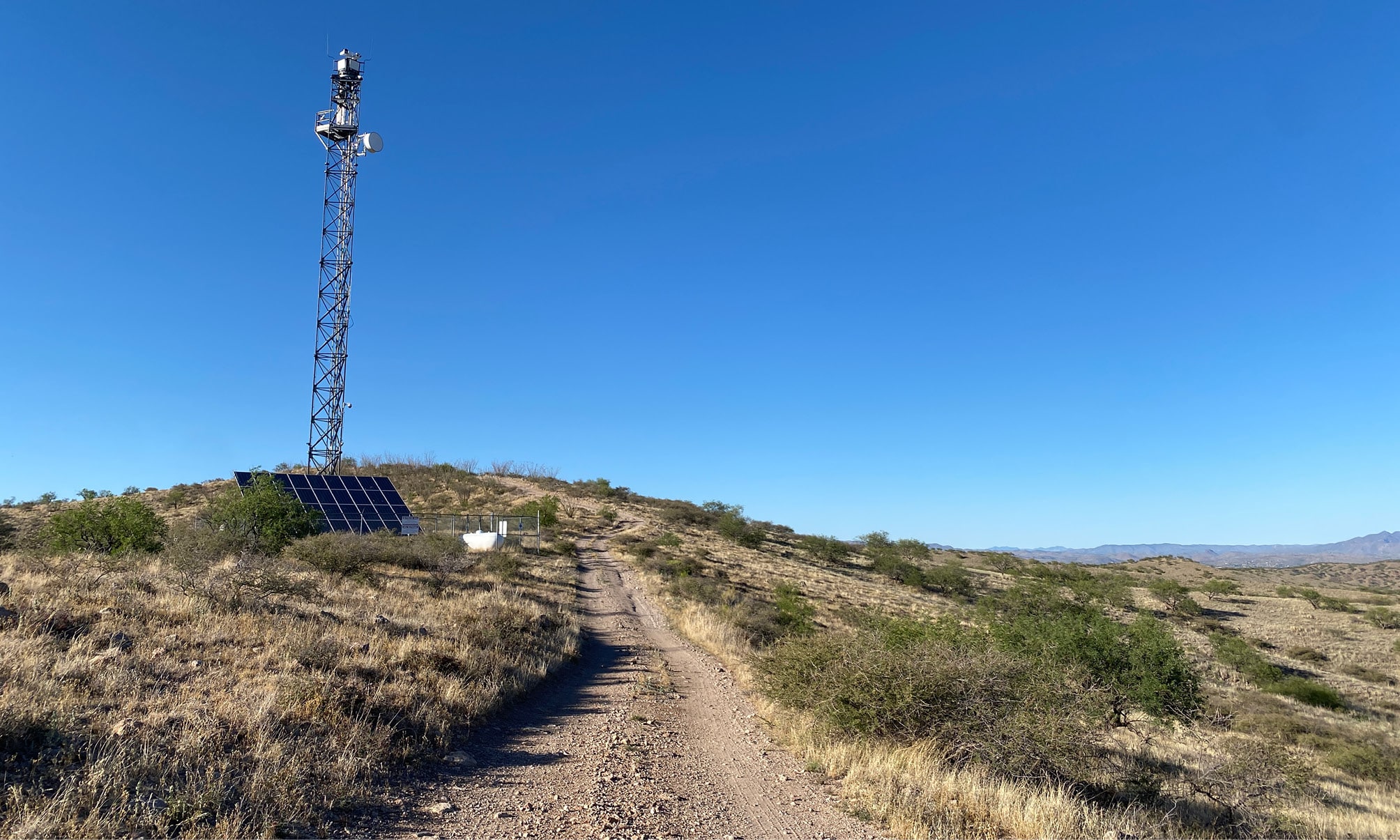Remote desert satellite tower with solar panels
